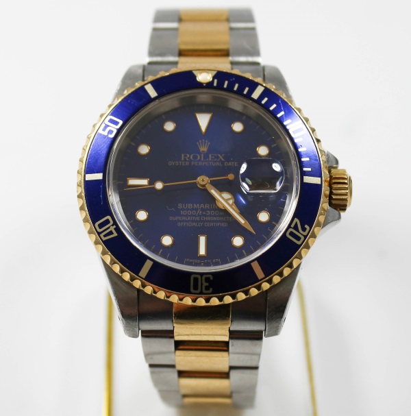 Rolex Submariner Herrenarmbanduhr aus Stahl und Gelbgold blaues Zifferblatt Faltschliesse Swiss made